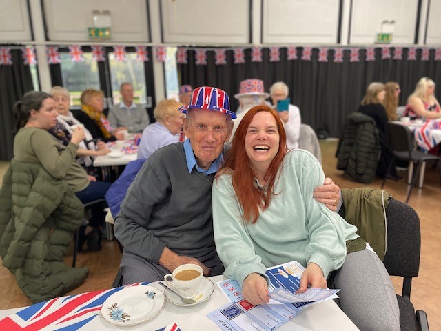 Norwich care home resident David smiles with Corton House administrator Sophie