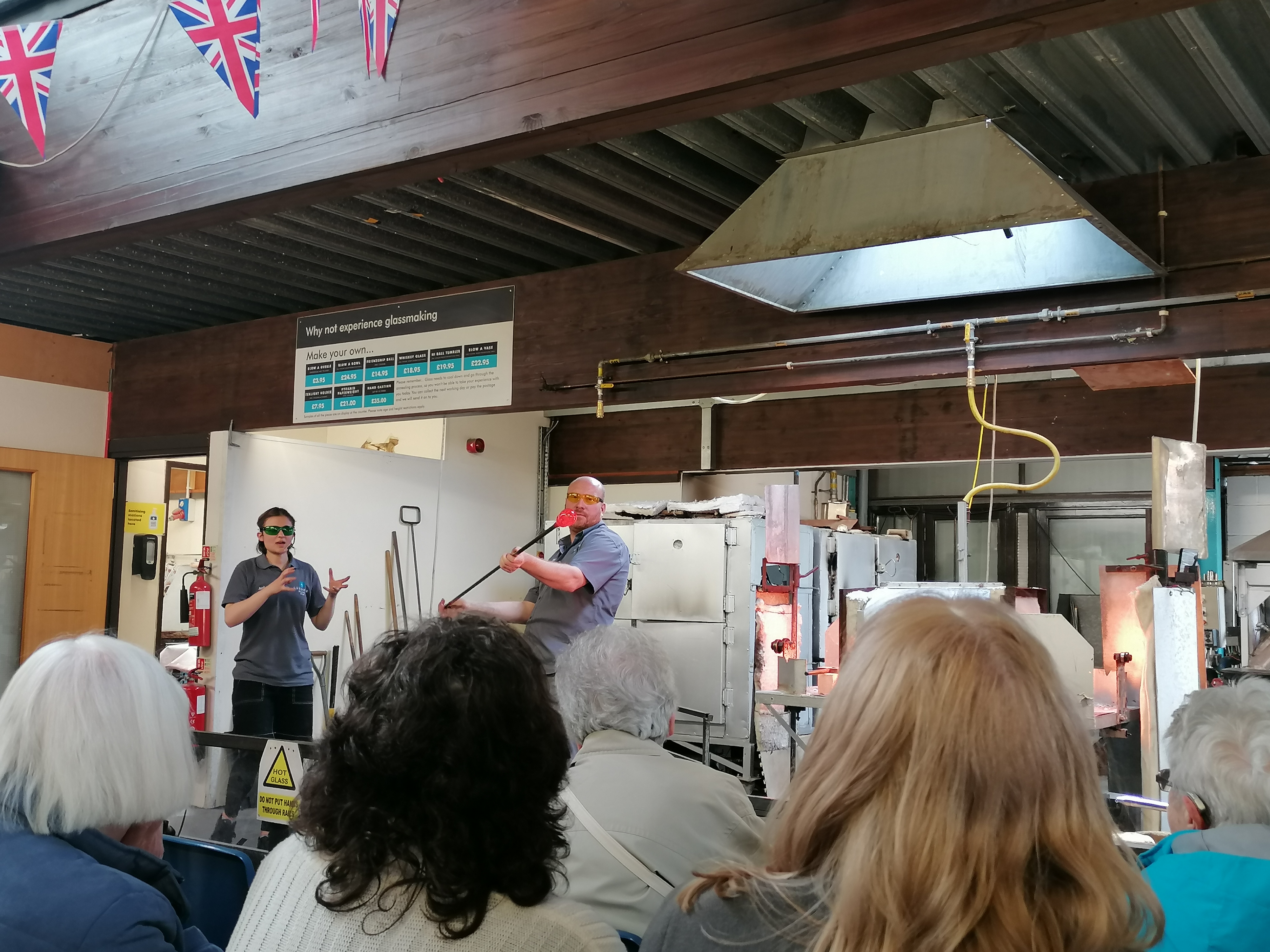 Brakendon Close tenants watching a glass making display.