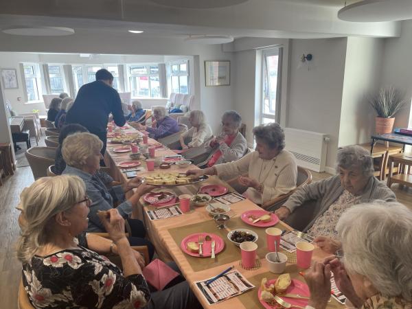Tenants at Brakendon Close independent living in Norwich enjoy a meal