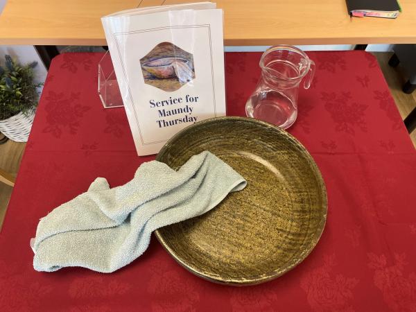 Maundy Thursday towel, bowl, jusg and service sheet display at Corton House.
