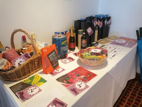 A selection of raffle prizes including football tickets, hampers and vouchers