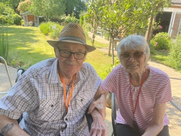 Residents and husband and wife, Brian and Judith in the sunny garden.