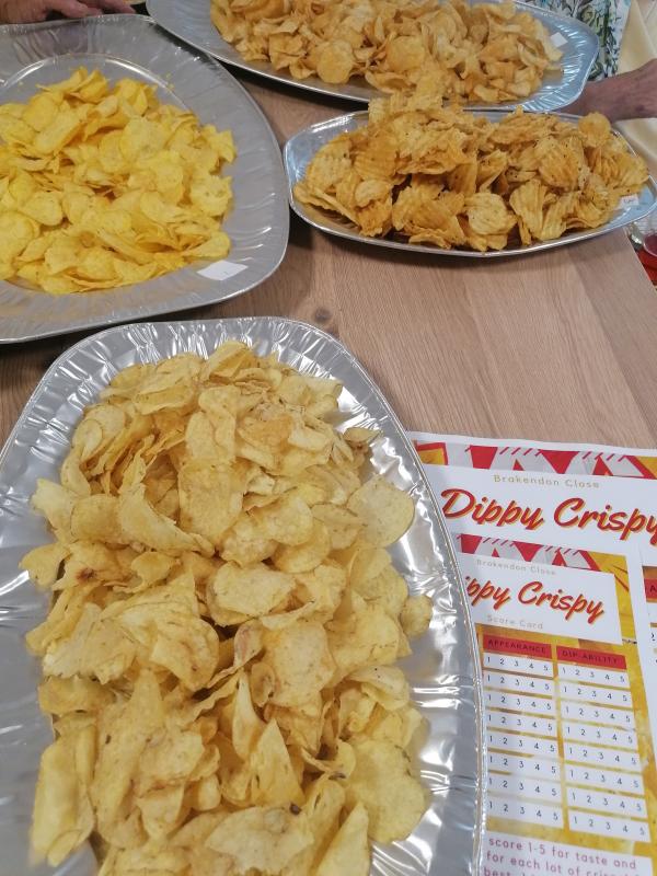 Platters of crisps and score cards at Brakendon Close's crisp taste test