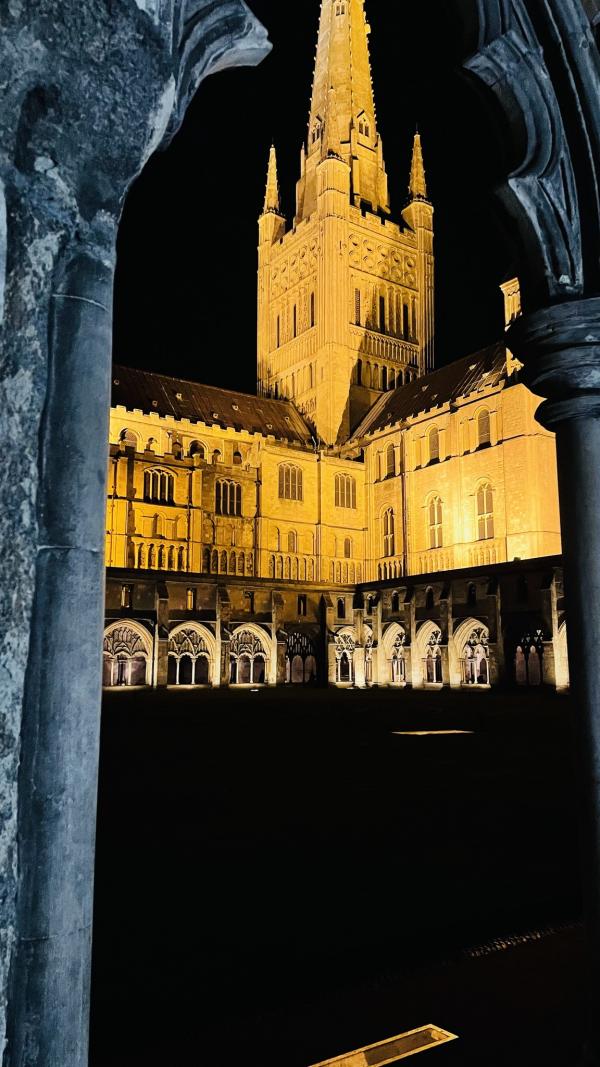 Norwich cathedral at night, taken from one of the archways inside the cloisters.