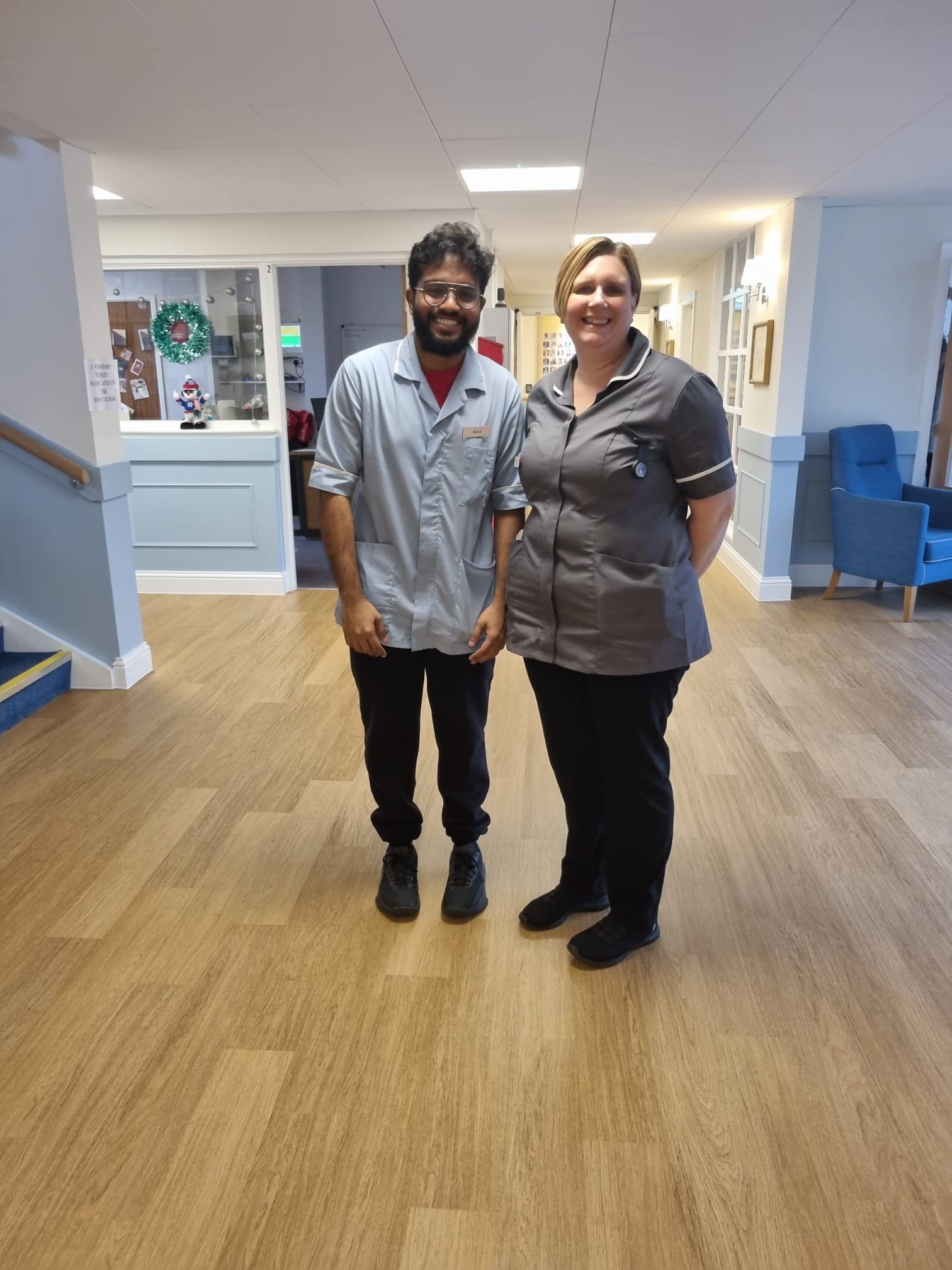 Staff working at Corton House care home on Christmas day, smiling in the foyer