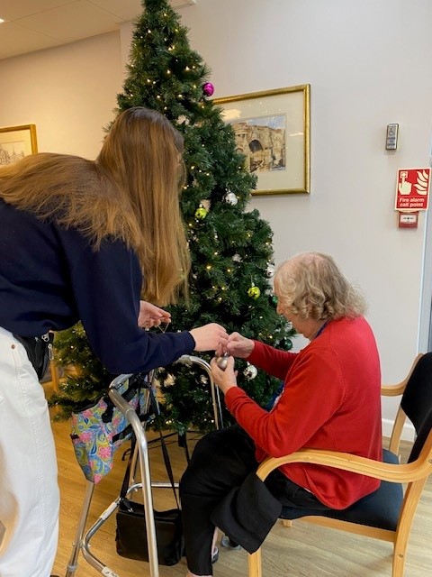 Decorating one of the Christmas Trees at Corton House care home
