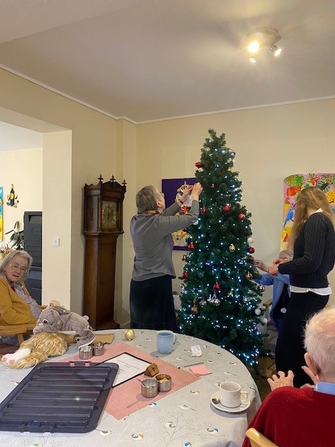 Decorating the Christmas tree in Norwich care home Corton House