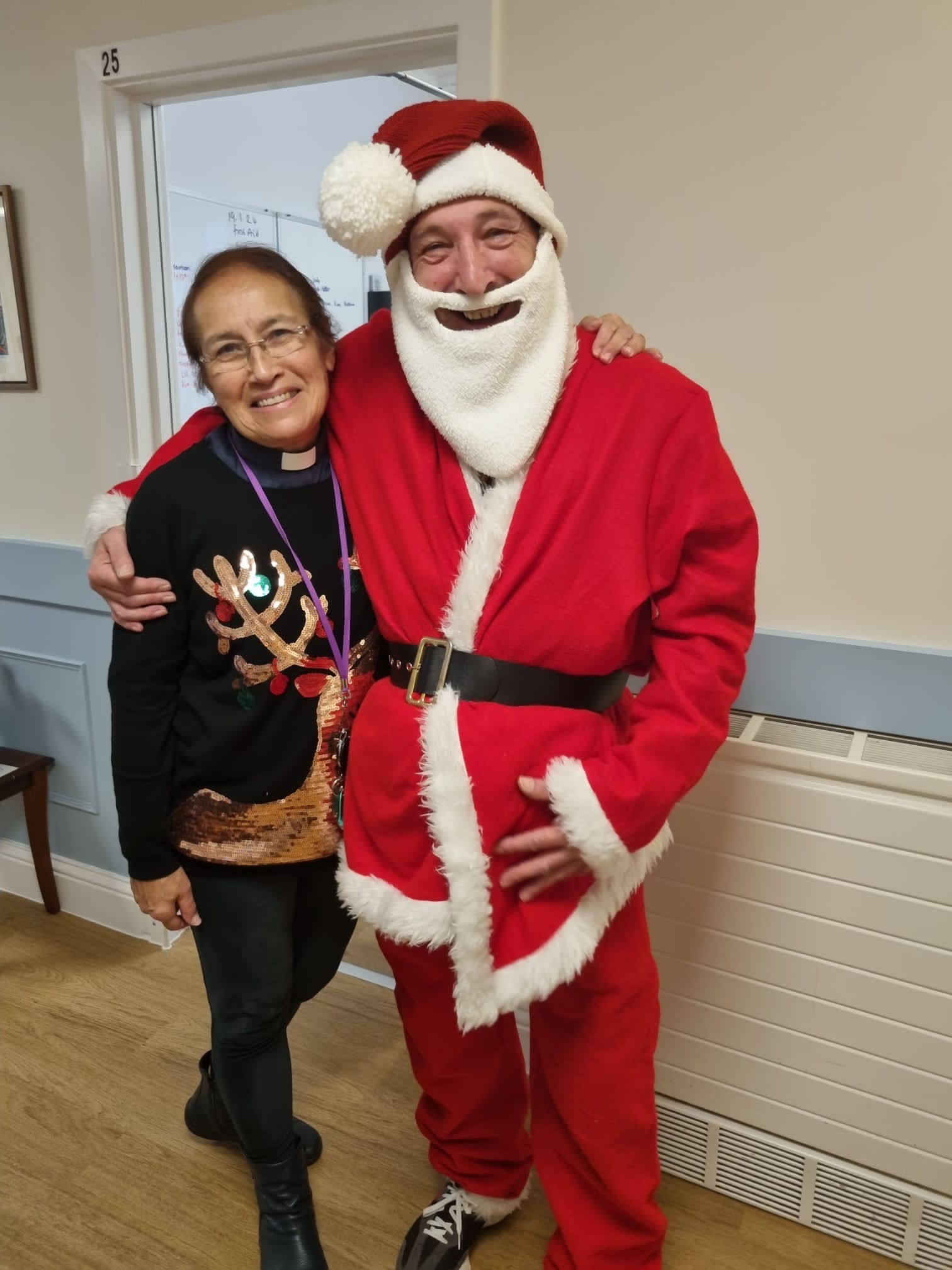 Manager Jason and Chaplain Rhonwen are dressed for Christmas in Corton House