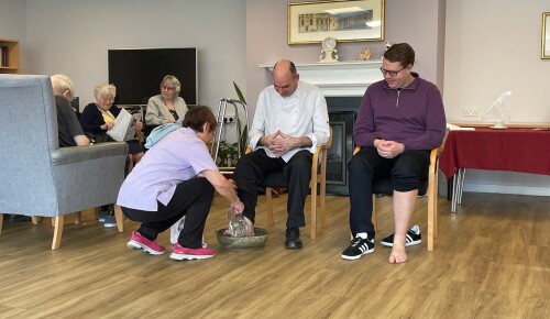 Staff and Chaplain at Corton House, a care home in Norwich with a Christian ethos, during the Maundy Thursday foot washing service.